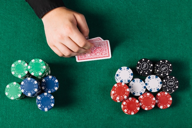 High Angle View Player S Hand With Playing Cards Near Poker Table 23 2147937958